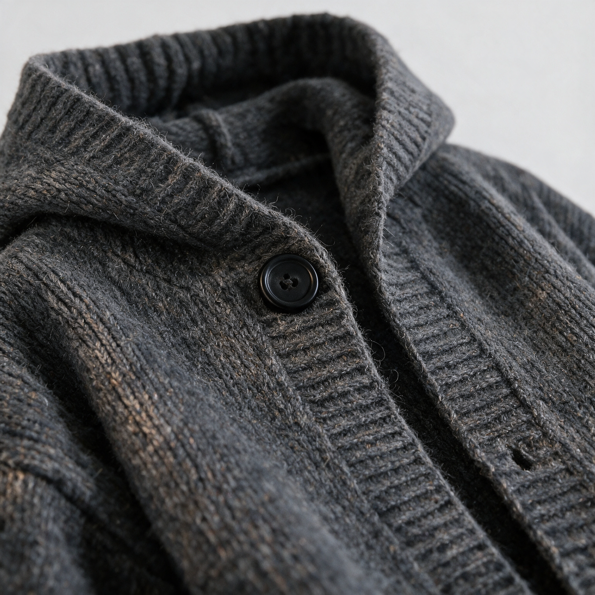 Vintage Hooded Cardigan in Dark Gray — AI-generated close-up of the knit and front button